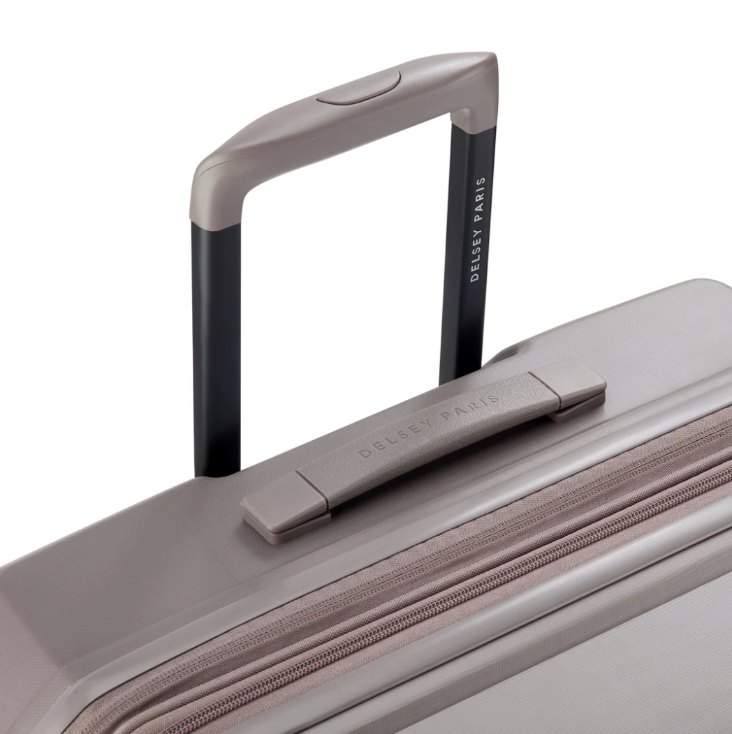 Close-up of a suitcase handle and top view with 'Delsey Paris' branding on a white background.
