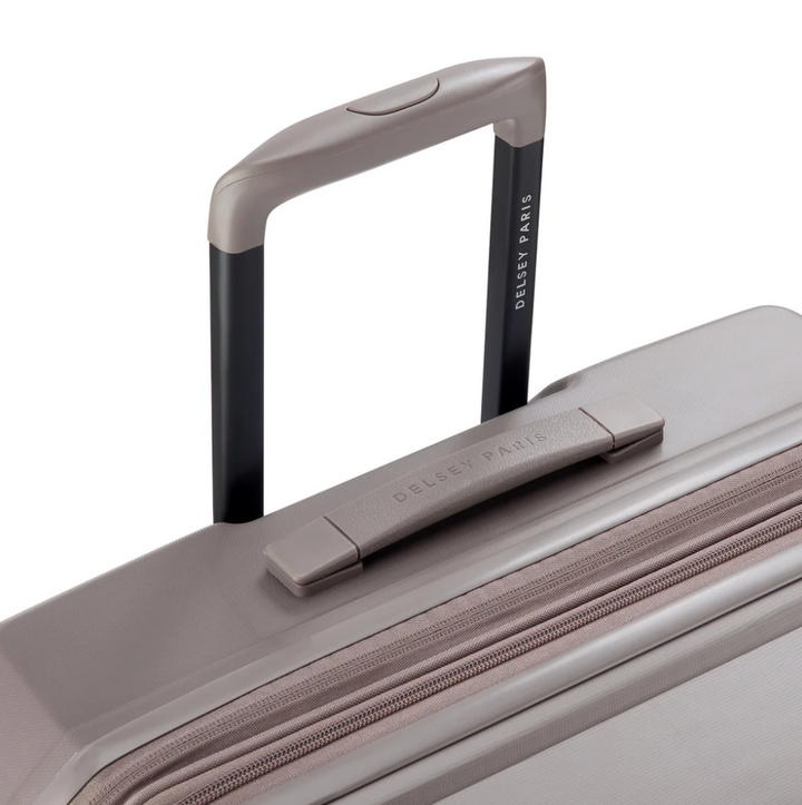 Close-up of a suitcase handle and top view with 'Delsey Paris' branding on a white background.