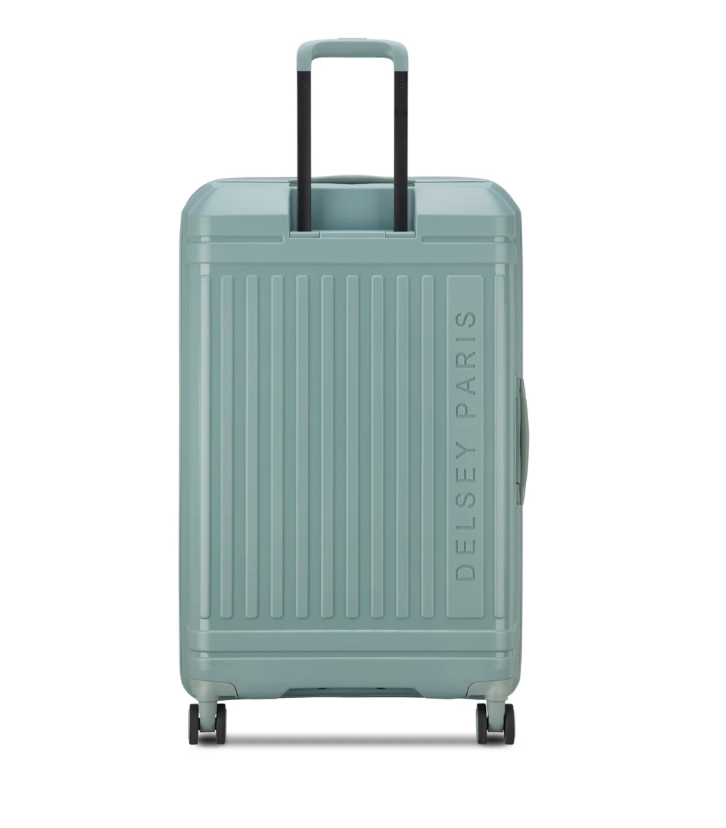 Back of a sage green suitcase with 'Delsey Paris' branding on a white background