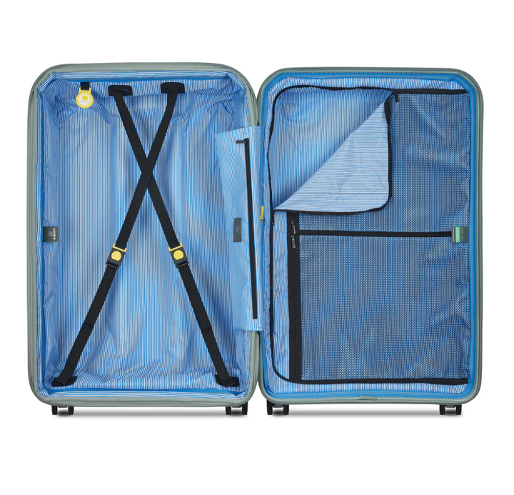 Open sage green suitcase with blue striped interior lining details and black compression straps on a white background