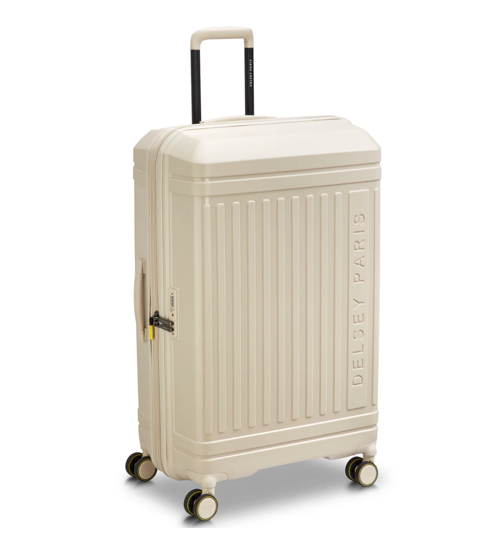 Beige suitcase with 'Delsey Paris' branding on a white background