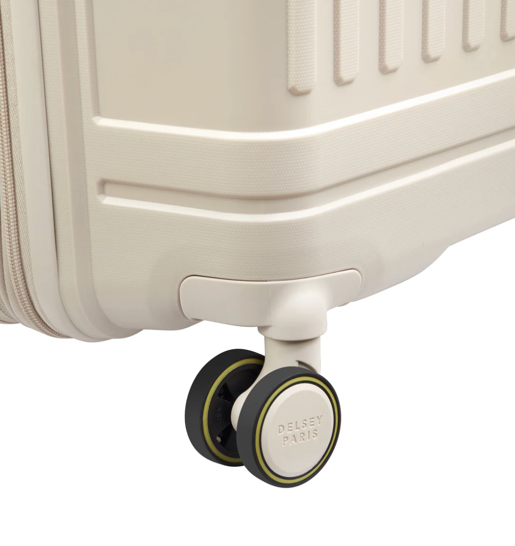 Close-up of a beige suitcase wheel with Delsey Paris branding on a white background