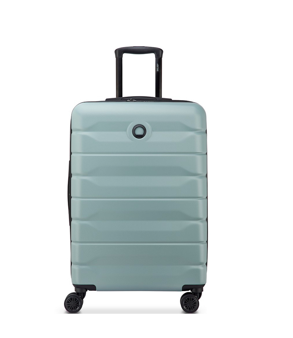 Sage Green Delsey suitcase with black wheels and handle on a white background