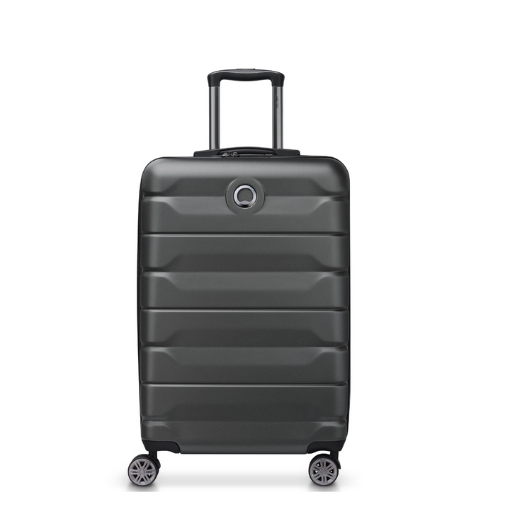 Black Delsey suitcase with wheels on a white background