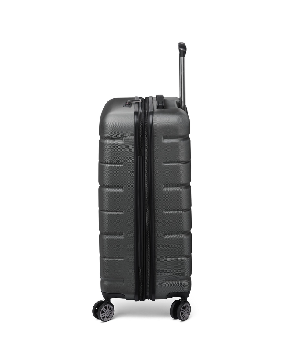 Side angle of a black Delsey suitcase with expandability and wheels on a white background