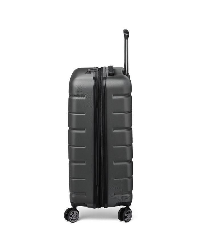 Side angle of a black Delsey suitcase with expandability and wheels on a white background