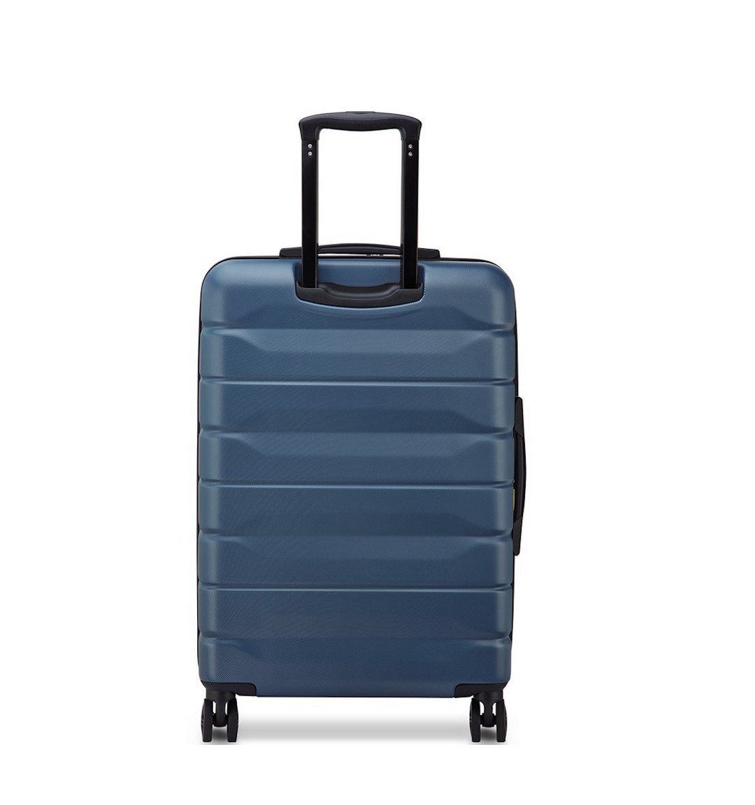 Back of a Blue Delsey suitcase with wheels and a handle on a white background