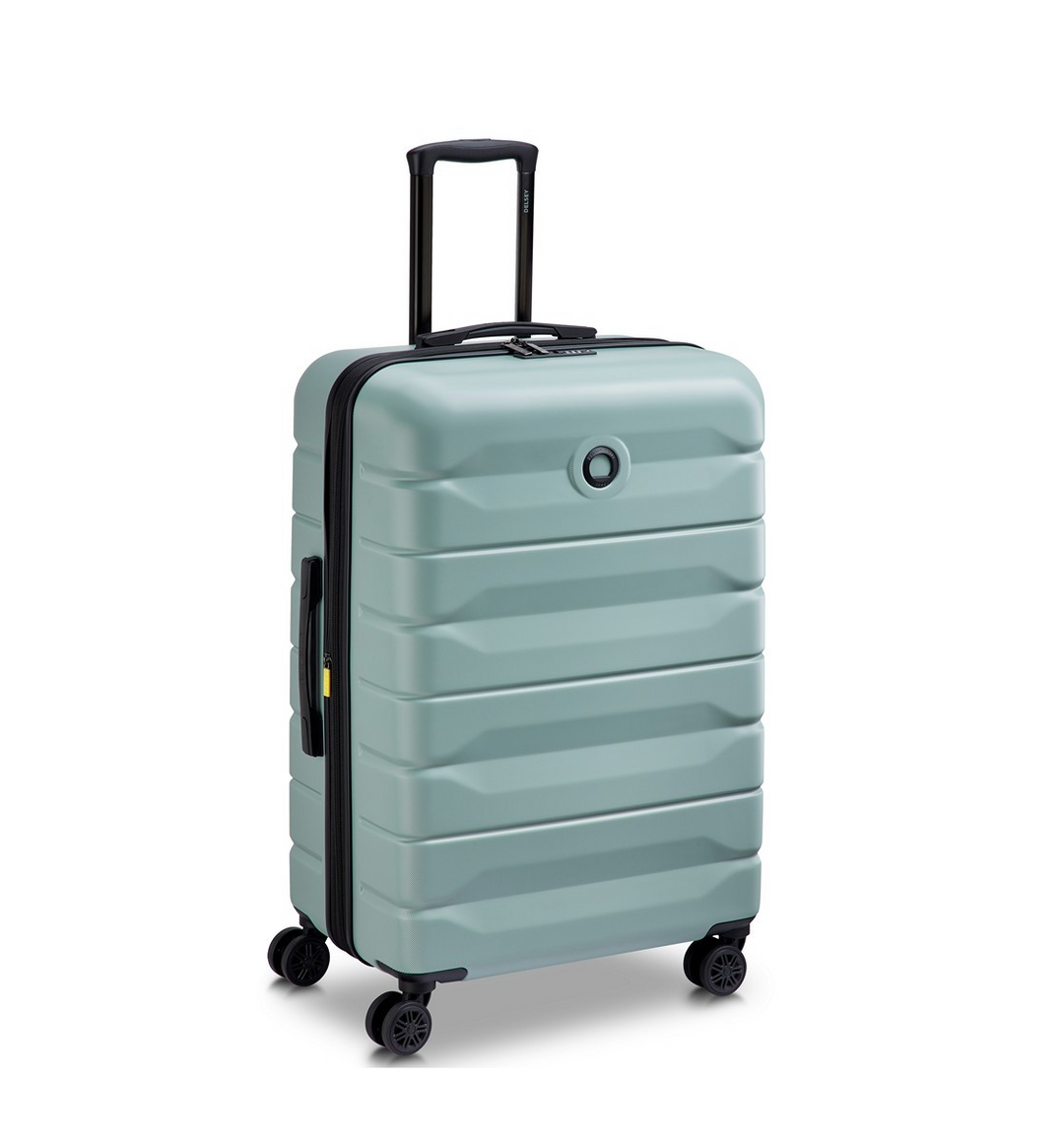 Sage Green Delsey suitcase with black wheels and handle on a white background