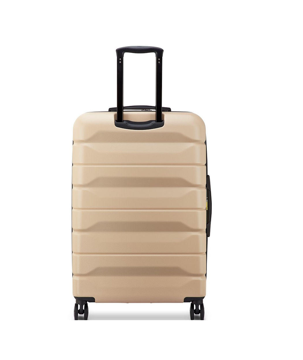Back of a Beige Delsey suitcase with black handle and wheels on a white background