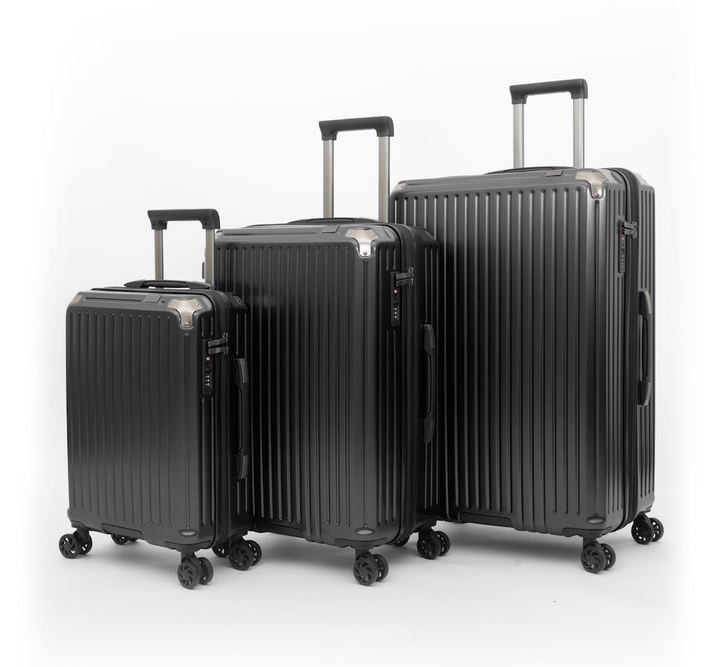 Three hard-shell spinner suitcases in black, shown in a size progression from smallest to largest on a clean white studio background.