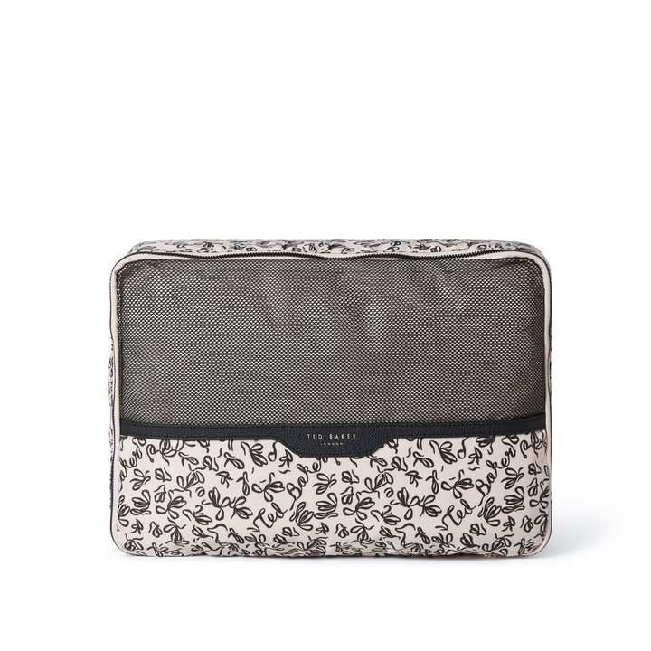 Large Ted Baker packing cube with black ribbon pattern on a cream lining material and PU Ted Baker branding on a white background