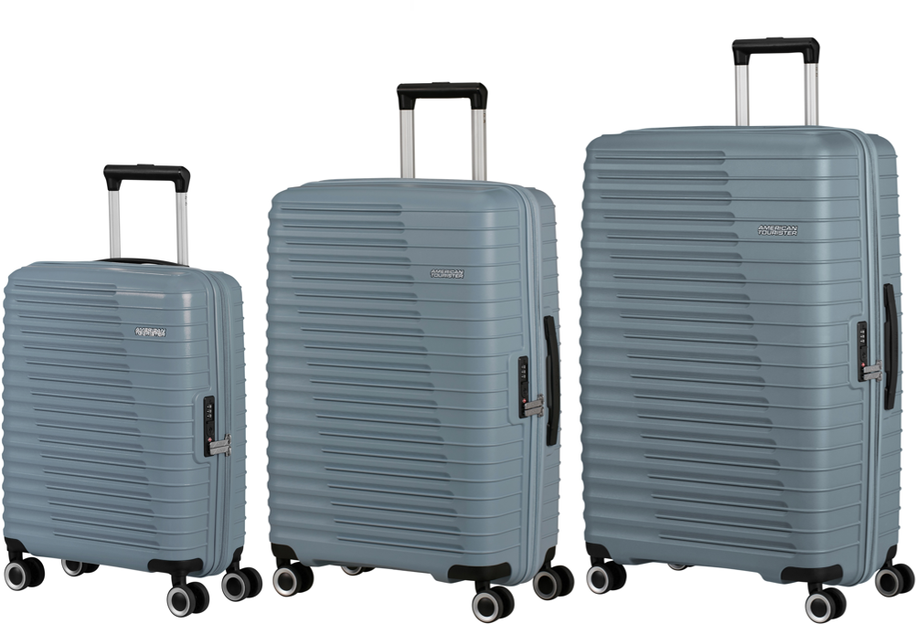 Three slate blue American Tourister suitcases of different sizes on a white background 