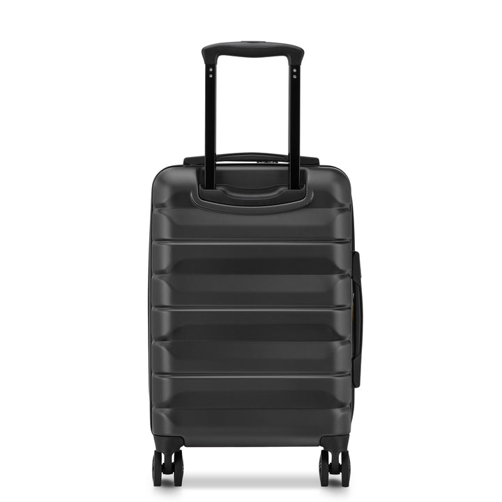 Back of a Black Delsey suitcase with black handle and wheels on a white background