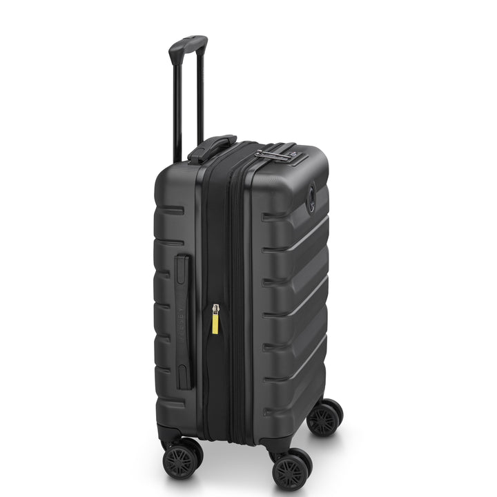 Side angle of a Black Delsey suitcase with black handle and wheels on a white background