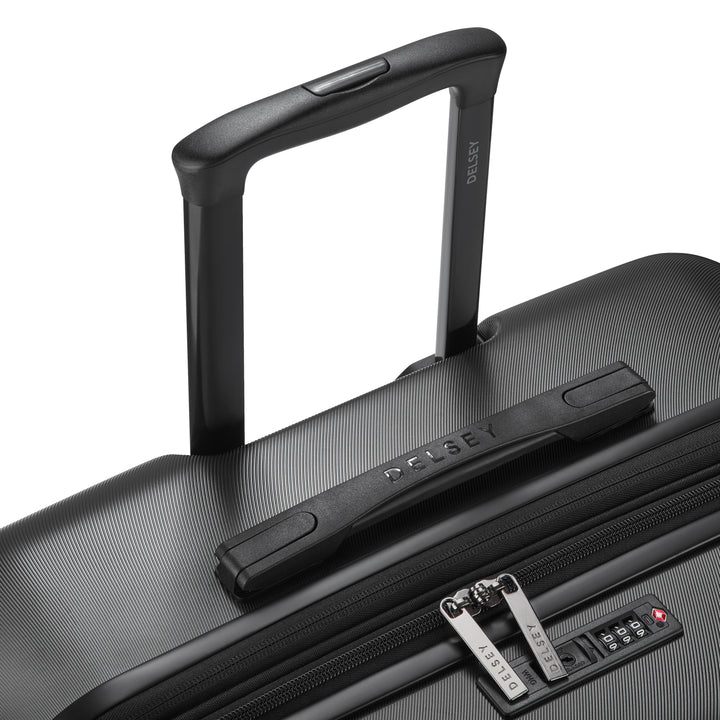 Black suitcase with handle and visible Delsey brand logo on a white background