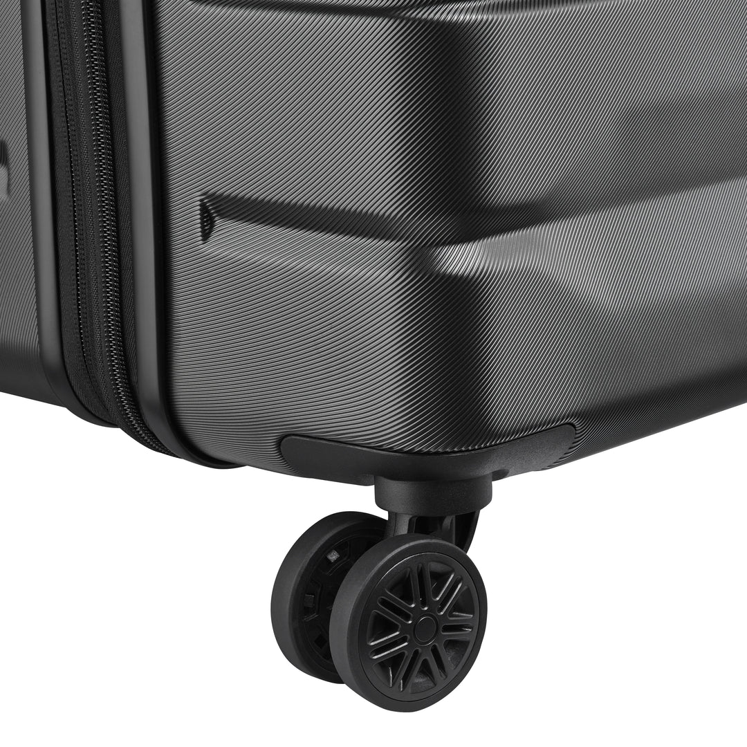 Close-up of a black suitcase with wheels on a white background