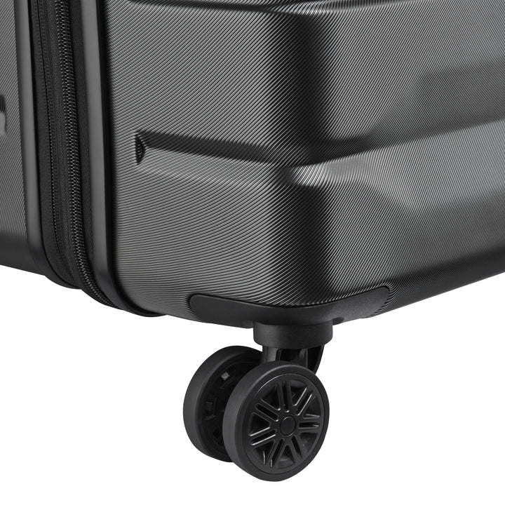 Close-up of a black suitcase with wheels on a white background