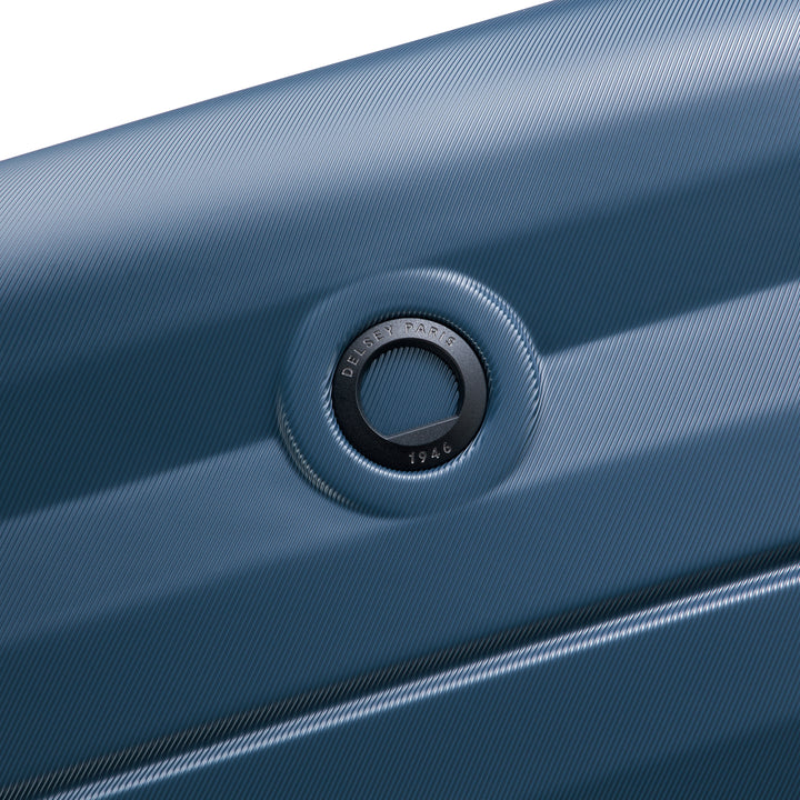 Close-up of a blue suitcase brand logo on a white background