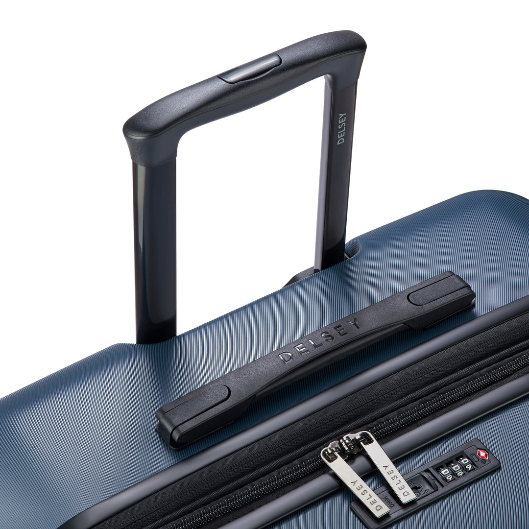 Blue suitcase with black handle and zipper on a white background