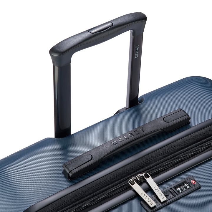Blue suitcase with black handle and zipper on a white background