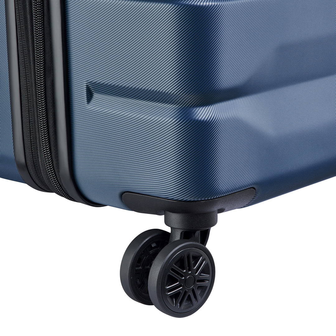 Close-up of a blue suitcase with a wheel on a white background
