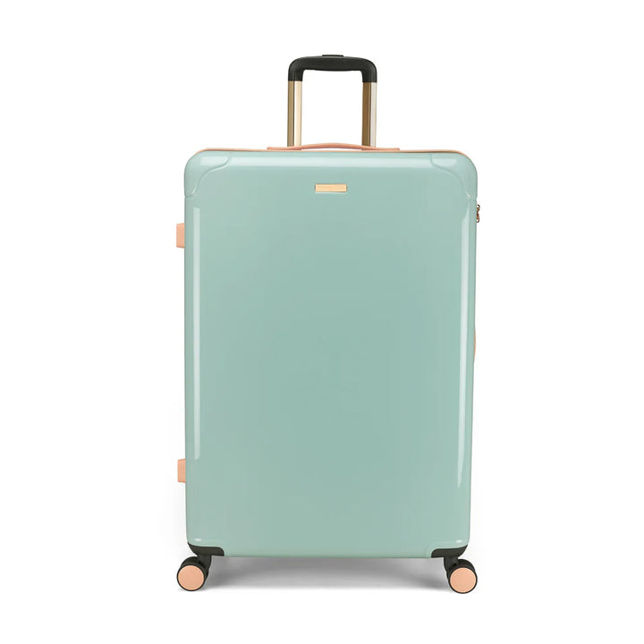 Mint green suitcase with gold handle and wheels on a white background