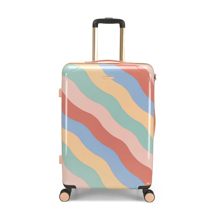 Colorful suitcase with wave pattern on a white background