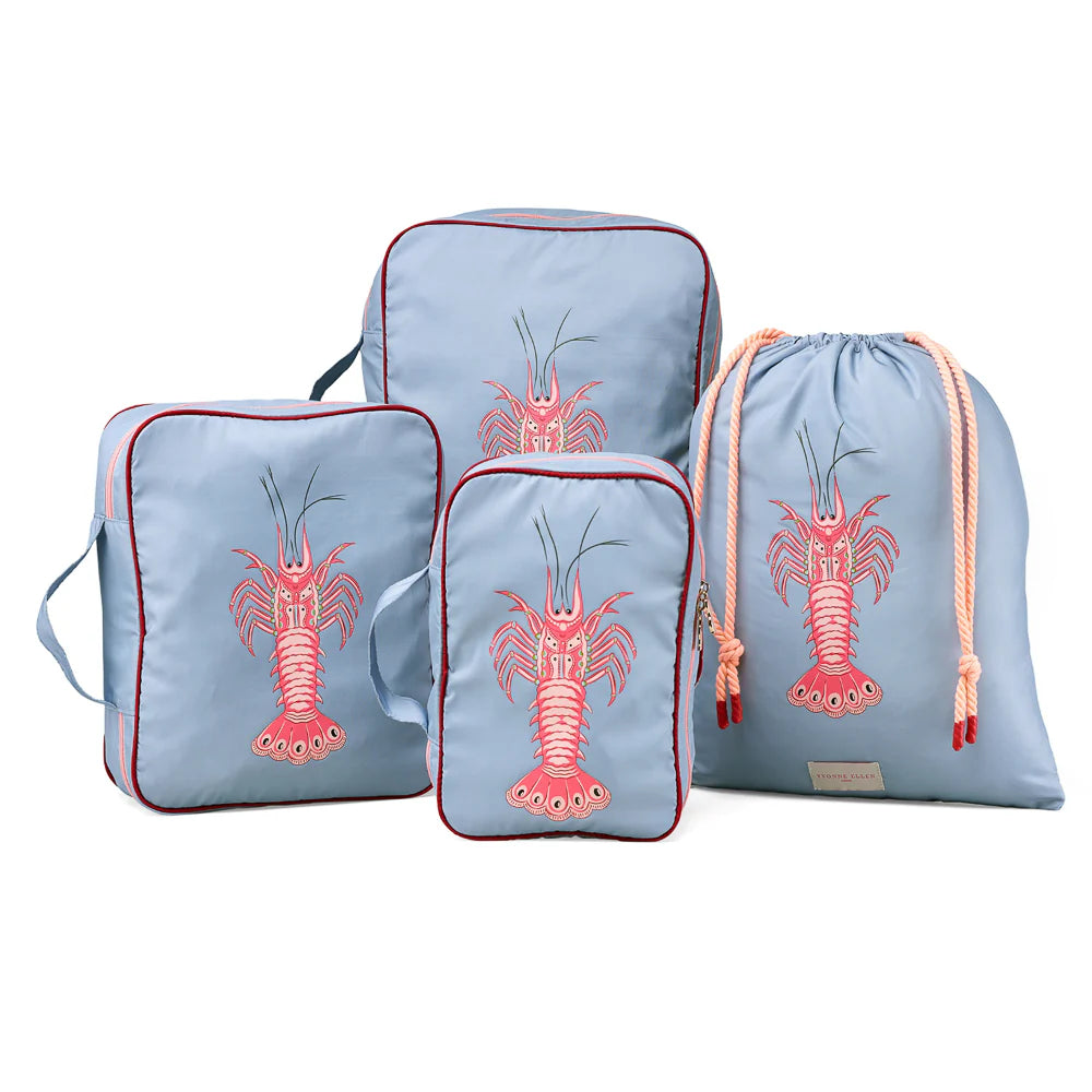 Set of blue packing cubes with lobster design on a white background